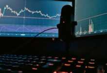 a computer monitor with a keyboard and mouse