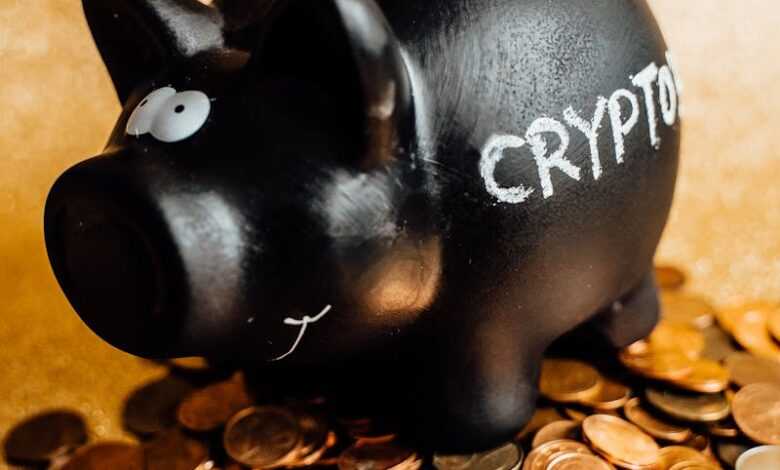 A black piggy bank labeled 'CRYPTO' surrounded by various coins on a gold background.