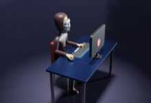 a skeleton sitting at a desk with a laptop and keyboard