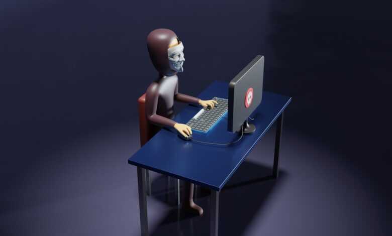a skeleton sitting at a desk with a laptop and keyboard