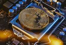 a bitcoin sitting on top of a computer motherboard