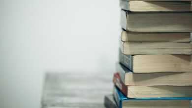 assorted books on wooden table