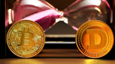 two bitcoins sitting next to each other on a table