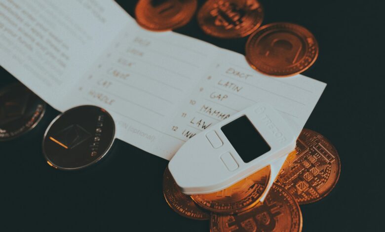 a cell phone sitting on top of a pile of coins
