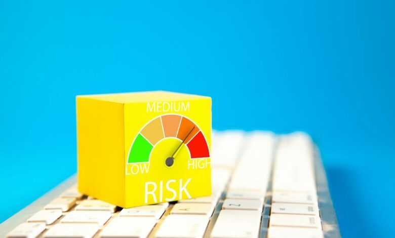 Yellow cube with risk meter on keyboard
