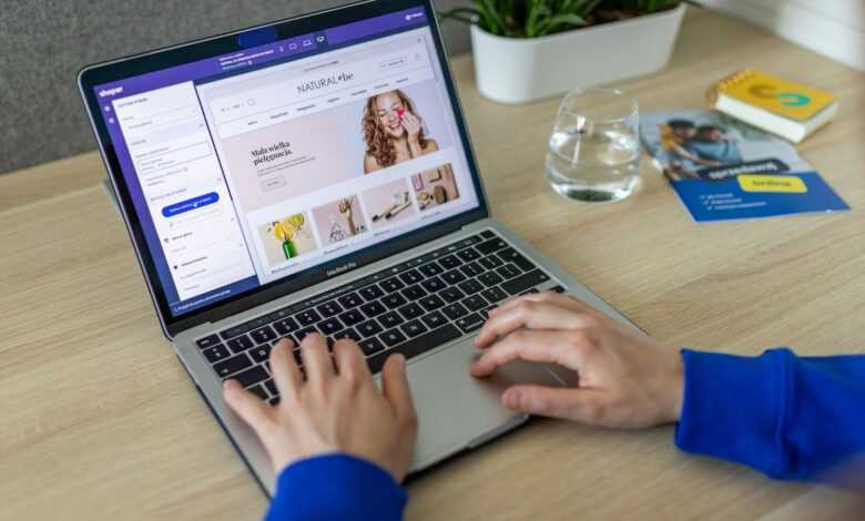 a person typing on a laptop on a table