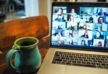 macbook pro displaying group of people