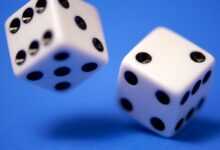 2 white dices on blue surface