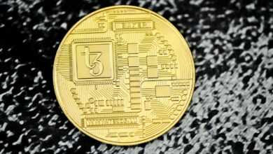 a close up of a coin on a black surface